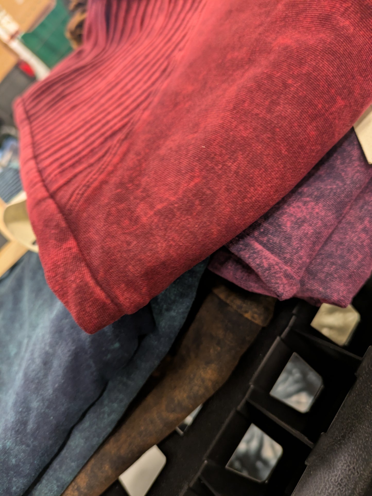 Stack of folded clothes including a red garment on a metal rack.
Stone wash moto leggings Canada , Canadian boutique, leggings, shape wear, moto, Stonewash, gift shop, Canadian clothing shop, colorful leggings
